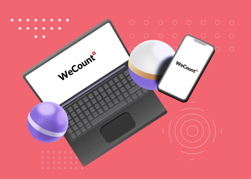 Laptop et smartphone affichant le logo WeCount sur fond corail, entourés de sphères 3D violettes et dorées avec motifs graphiques — illustration des supports digitaux de la fiduciaire WeCount pour la gestion comptable en ligne.